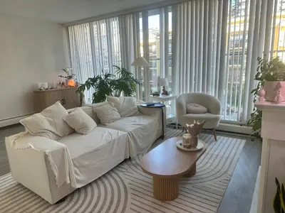 a living room with a white couch and a chair at Beach House in Vancouver