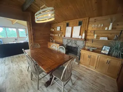 a dining room with a wooden table and chairs at Lakeview Mountain Retreat - Private, Modern, Fun in Windermere