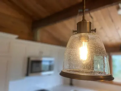 a glass light bulb hanging from a ceiling at Lakeview Mountain Retreat - Private, Modern, Fun in Windermere