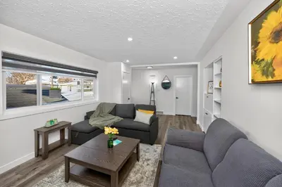 a living room with a couch and a table at NEW 2BR Near Downtown Calgary - Private Entry - Airport Access - 4412 UP in Calgary