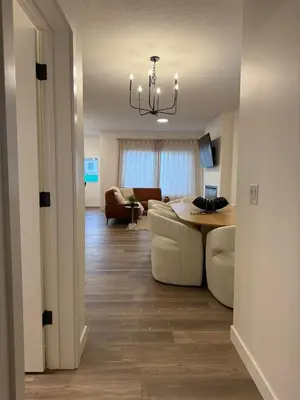 a living room with a couch and a table at Fort Home in Fort Saskatchewan