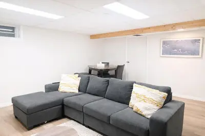 a living room with a couch and a table at 4-Level Split Home in Southeast Edmonton in Edmonton