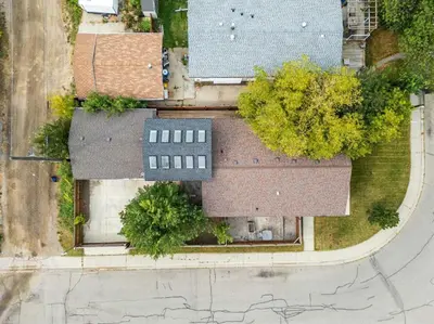 an overhead view of a building with a roof at Modern 3Bed Home with Fireplace, Game Room, and Stylish Comfort Just 12 Minutes from Downtown Calgary in Calgary