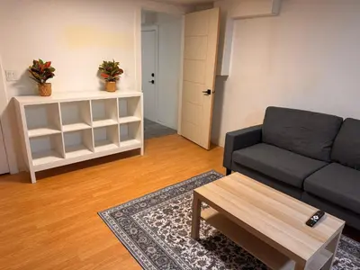 a living room with a couch and a coffee table at Amalak Homes' Private 2BR Guest Suite North Delta in Delta