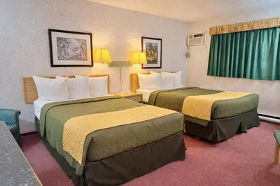 a hotel room with two beds in a room at Rychter Hotel Hope in Hope