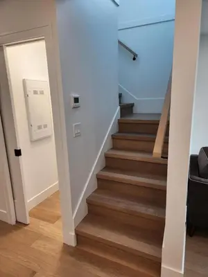 a hallway with stairs leading up to a room at The Rupert Split Flexible Family Living in Vancouver