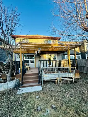 a house with a gazebo and a staircase leading to it at Jeli haus in Calgary