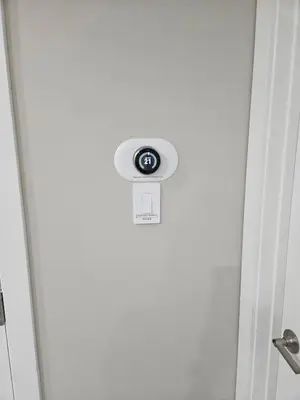 a door with a button on the side of it at 2 Bedroom Smart Secondary Suite with Gazebo view in Calgary