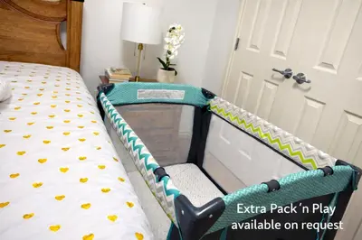 a bedroom with a bed with an exit back inplay available on request at Private Suite in Airdrie Near Calgary Free Parking in Airdrie