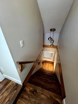 a staircase in a house with wooden floors at A Cozy Nest, Private Tiny Home in Vancouver