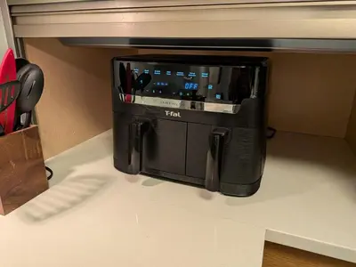 a black coffee maker sitting on top of a counter at Designer 2-Bedroom Garden-Level Walk-Out Suite in Surrey