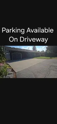 a picture of a parking available on a driveway at Private Entrance OFFICE SPACE King Suite in Mission City