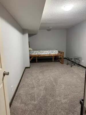 a room with a bench in the corner of a room at Cowboy Cabin- Lakefront Rental Northern Saskatchewan