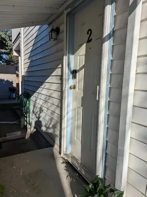 a door to a house with the number two on it at 2 bedroom suite close to Main and Skytrain in Vancouver