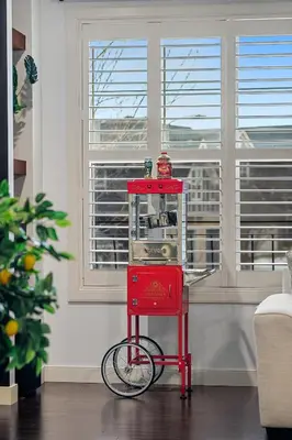 a red machine in a room with a window at Luxury Haven | Pool | Hot Tub & Sauna |Outdoor BBQ in Calgary