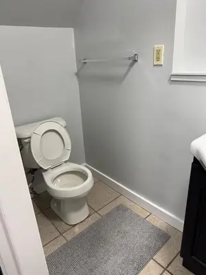 a bathroom with a white toilet in a room at Super bright and beautiful home with all you need in Delta