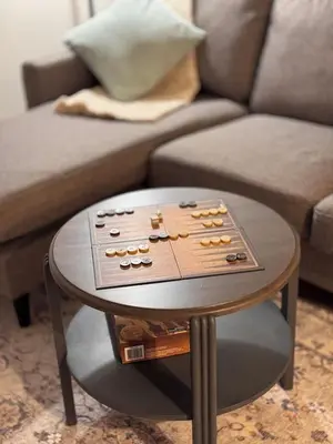 a table with a board game on it in a living room at Rosie Cozy Retreat in Victoria