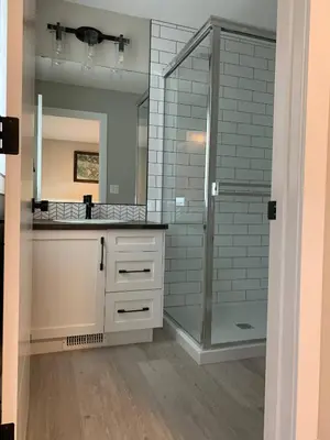 a bathroom with a glass shower and a sink at New townhouse in Red Deer -Family retreat in Red Deer