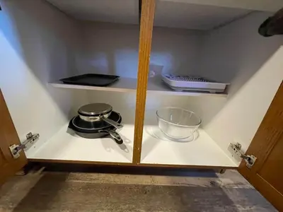 a cabinet with a pot and a bowl on it at The Longhorn cabin - Bear Creek Cabins in Winfield