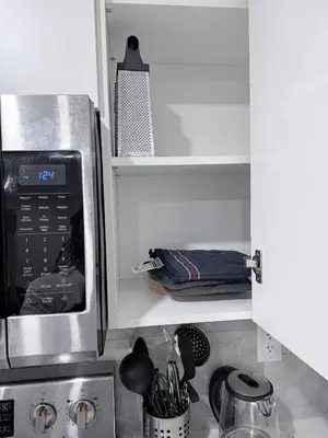 a kitchen with a microwave oven and a counter top at Charming Family-Friendly House Rental in Edmonton in Edmonton