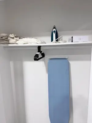 a white table with a shelf on top of it at Charming Family-Friendly House Rental in Edmonton in Edmonton