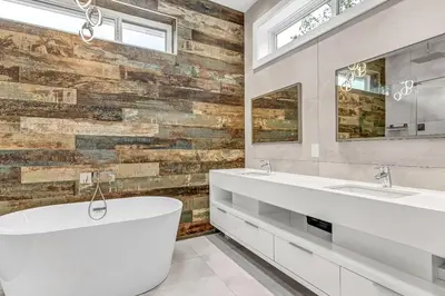 a bathroom with two sinks and a large tub at Fabulous Modern Home Near Downtown Vancouver in Vancouver