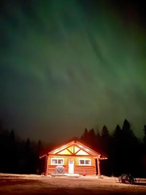 a small cabin with a dark sky in the background at The Yellowstone cabin - part of Bear Creek Cabins in Winfield