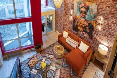 an overhead view of a living room with a brick wall at Casa DT Vancouver - Mexican Theme in Vancouver