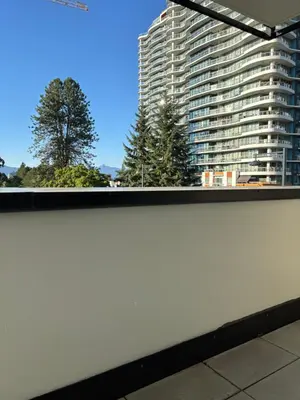 a view of a large building from a window at Cozy 1 bed and 1bath suit in Surrey