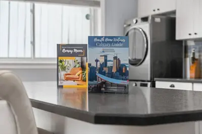 a kitchen counter with a microwave and a book on it at Bright and Open Coziness. 10 minutes to Stampede in Calgary