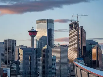 a city skyline with skyscrapers and the space needle at Bright and Open Coziness. 10 minutes to Stampede in Calgary