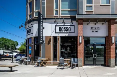 a store with a sign that reads rosso at Bright and Open Coziness. 10 minutes to Stampede in Calgary