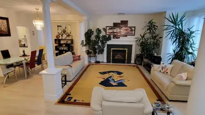 a living room with a couch and a fireplace at Premium stay in Metro Vancouver-World Cup ready in Coquitlam