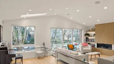 a living room with a couch and a table at Modern 3-Bdrm Home & Parking - Cambie Village-VGH in Vancouver
