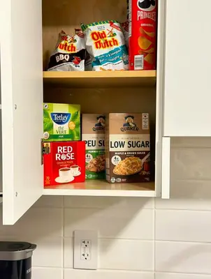 a cabinet with some foodabandabandabandabandabandabandabandabandabandabandaband at Luxury 2-Bedroom Suite at Bear Mountain Victoria in Langford