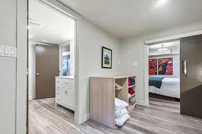 a bedroom with a large mirror and a closet at Bright & Cozy Central Retreat in Calgary