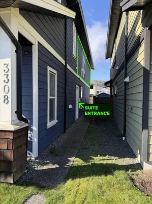 a building with a smile entrance sign on it at Private 1BR, AC, Strong Wi-Fi, Netflix and Amazon Prime in Victoria