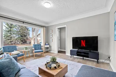 a living room with a tv and a couch at Modern House-3BR/Spacious good for 8/Free Parking in Edmonton