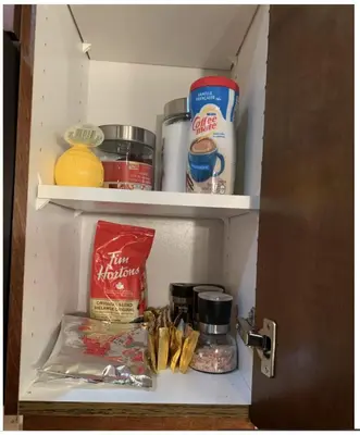 a refrigerator filled with food and other food items at Canmore Mountain View in Canmore