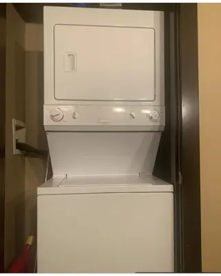 a white refrigerator with its door open in a room at Canmore Mountain View in Canmore