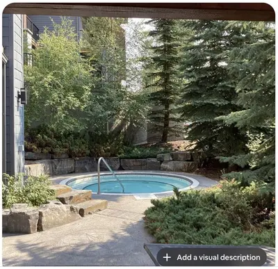 a small swimming pool in a yard with trees at Canmore Mountain View in Canmore