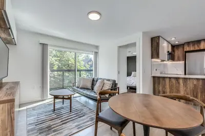 a living room with a couch and a table at Luxury 2BR Walk to Everything Downtown in Vancouver