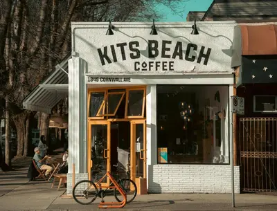a bike parked in front of a nuts beach cafe at City Line Views w Rooftop Patio in Vancouver