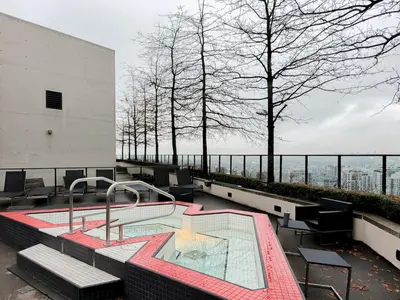 a hot tub on the top of a building at Gastown Unbeatable View 1 Bedroom High Floor Condo Rooftop View of Downtown in Vancouver