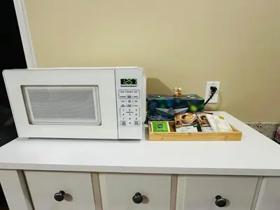a microwave oven sitting on top of a counter at Moon rooms in Vancouver