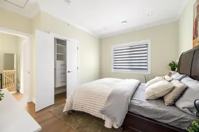 a bedroom with a large bed and a window at Modern Vancouver Private Room-15 Mins to Downtown in Vancouver