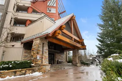 a house with an awning on the front of it at Ski-in and Out Lake Placid Lodge in Whistler