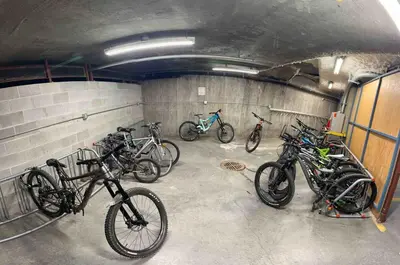 a group of bikes parked in a garage at Heart of Whistler Village, Mountain Views, Pool & Hot Tub in Whistler
