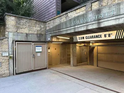 an entrance to a building with two garage doors at Heart of Whistler Village, Mountain Views, Pool & Hot Tub in Whistler