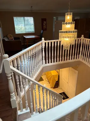an overhead view of a white staircase with a room at Nordel Way Guest House - Walk to Transit & Shopping - 20 Min to YVR in Surrey